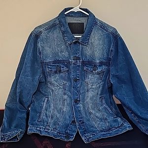 Long sleeve blue denim jacket.UGB Brand name with front and cuff buttons.